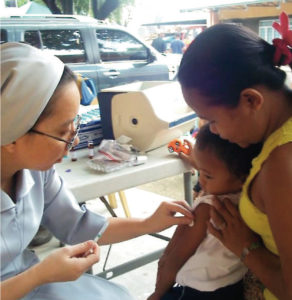 Sister Maureen treats tuberculosis patients in the Philippines.