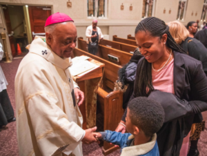 Archbishop Gregory greets Holy Redeemer parishioners.