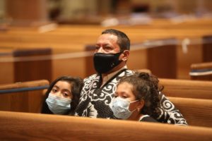 A family prays in church
