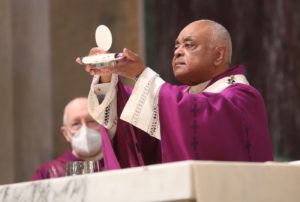 Cardinal Gregory elevates the Eucharist on Ash Wednesday