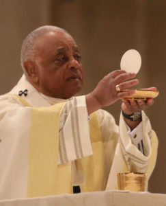 Cardinal Gregory elevates the Eucharist