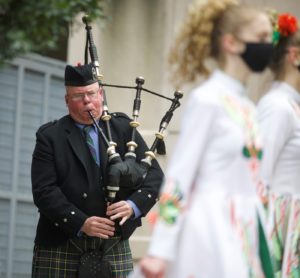 A man plays the bagpipes at the St. Patrick's Day Mass