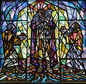 Stained glass window at Our Lady Queen of Americas. Jesus with a Lamb.