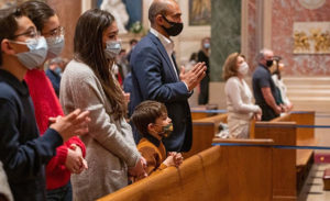 Family Praying Mass During Pandemic