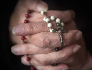 Hands Praying Rosary