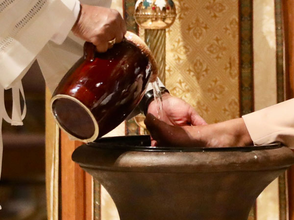 Cardinal Gregory washes feet on Holy Thursday at the Cathedral of St. Matthew the Apostle.