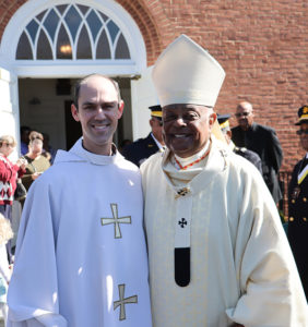 Cardinal Wilton Gregory with Father Mark Cusick
