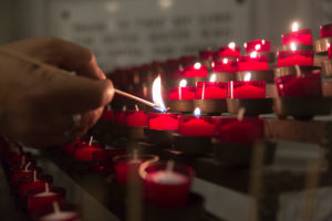 A man lights a candle