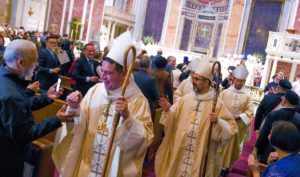 Bishop Evelio Menjivar-Ayala, at left, and Bishop Juan Esposito-Garcia, at center