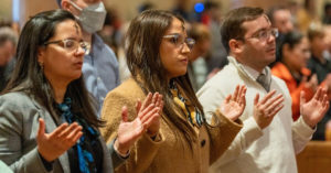 People pray during Ash Wednesday Mass