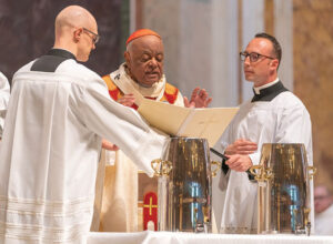 Cardinal Wilton Gregory blesses sacramental oils during the Chrism Mass
