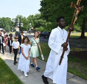 people walk in the procession