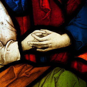 Stained Glass picture of holding hands